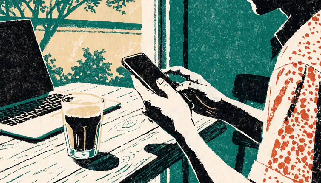 Person using a smartphone in a bright Australian cafe, representing online privacy and cookie usage.